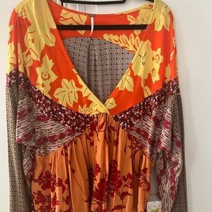 Free people top never been worn tags still on it!